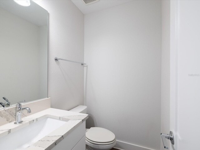 946 Highland Ave Unit 24, Dunedin, FL 34698 - bathroom featuring toilet and vanity
