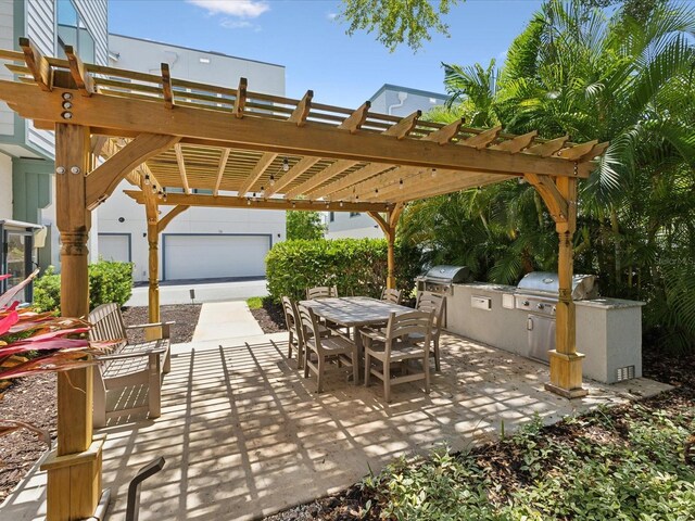 946 Highland Ave Unit 24, Dunedin, FL 34698 - view of patio / terrace featuring area for grilling, outdoor dining space, a grill, and a pergola