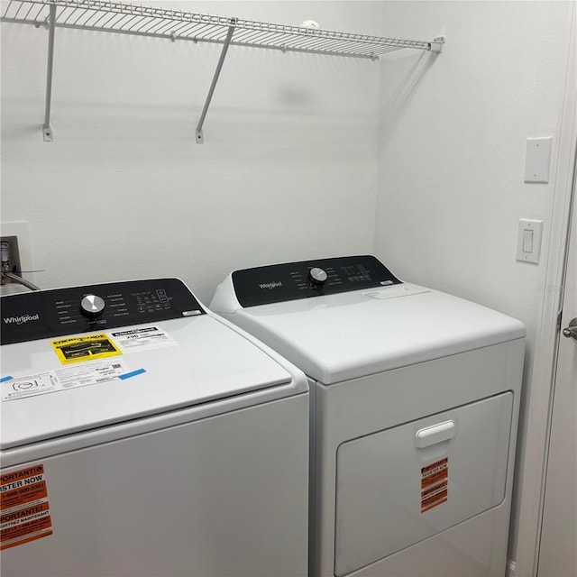 12055 Cardinal Flower Dr, Riverview, FL 33579 - laundry room with washer and clothes dryer