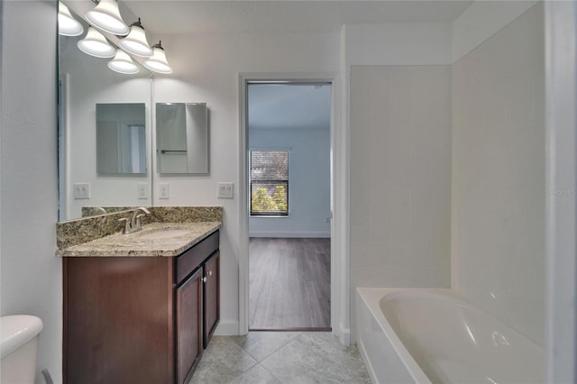 12055 Cardinal Flower Dr, Riverview, FL 33579 - bathroom featuring toilet, vanity, and tile patterned floors