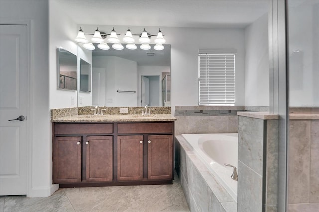12055 Cardinal Flower Dr, Riverview, FL 33579 - full bathroom featuring a bath, double vanity, and tile patterned flooring