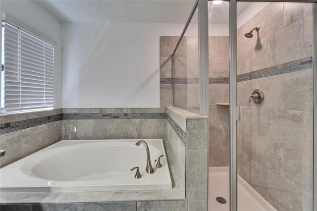 12055 Cardinal Flower Dr, Riverview, FL 33579 - bathroom featuring a stall shower and a garden tub