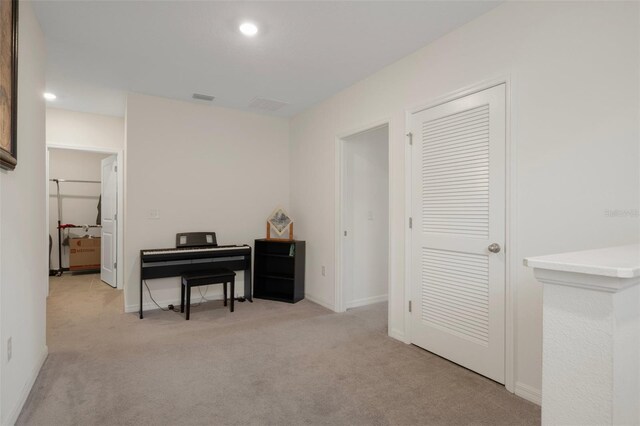 2449 Moon Shadow Rd, New Port Richey, FL 34655 - sitting room featuring light carpet, baseboards, and recessed lighting