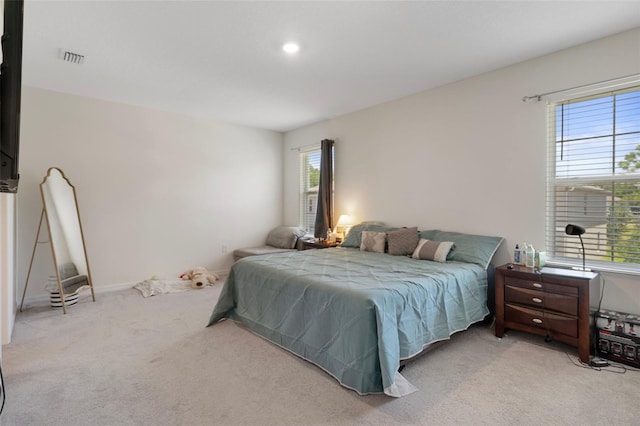 2449 Moon Shadow Rd, New Port Richey, FL 34655 - bedroom with multiple windows, carpet flooring, and recessed lighting