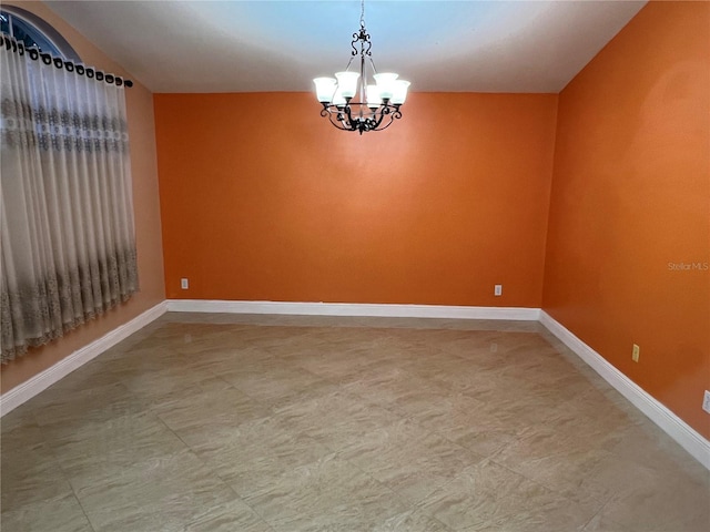 18104 Sweet Jasmine Dr, Tampa, FL 33647 - unfurnished room featuring a chandelier and baseboards