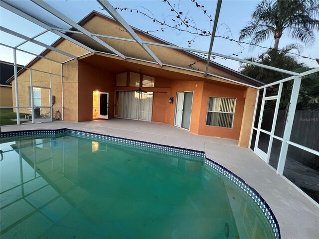 18104 Sweet Jasmine Dr, Tampa, FL 33647 - outdoor pool featuring a lanai, a patio, and a ceiling fan