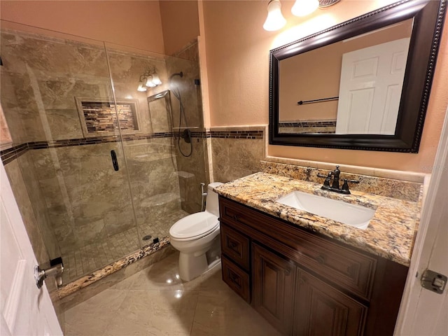 18104 Sweet Jasmine Dr, Tampa, FL 33647 - full bathroom featuring vanity, a stall shower, tile walls, and a wainscoted wall