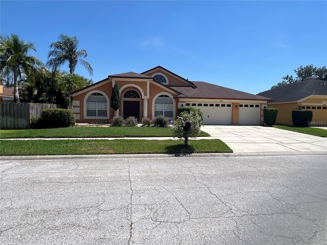 18104 Sweet Jasmine Dr, Tampa, FL 33647 - view of front of property with an attached garage, concrete driveway, and stucco siding