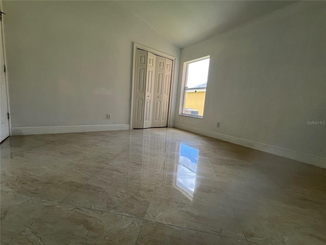 18104 Sweet Jasmine Dr, Tampa, FL 33647 - unfurnished bedroom featuring lofted ceiling and a closet