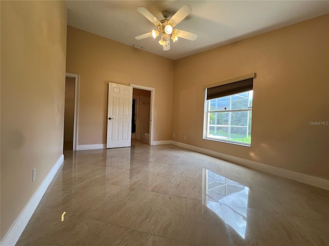 18104 Sweet Jasmine Dr, Tampa, FL 33647 - spare room featuring baseboards and ceiling fan
