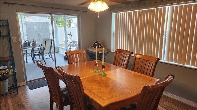 dining area with wood finished floors, baseboards, and a ceiling fan