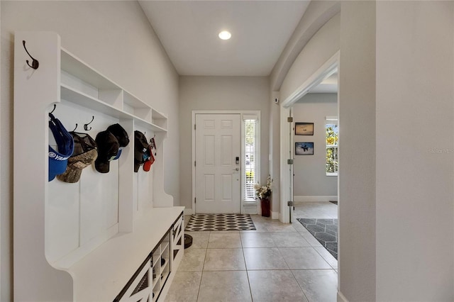 mudroom featuring baseboards, light tile patterned flooring, and recessed lighting