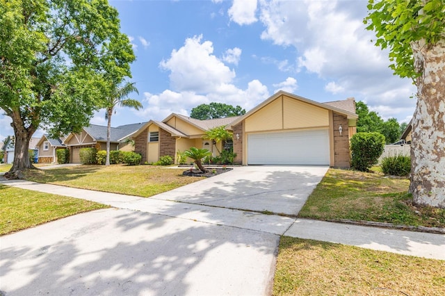 1426 Buckner Rd, Valrico, FL 33596 - view of front of property with a front lawn, driveway, and a garage
