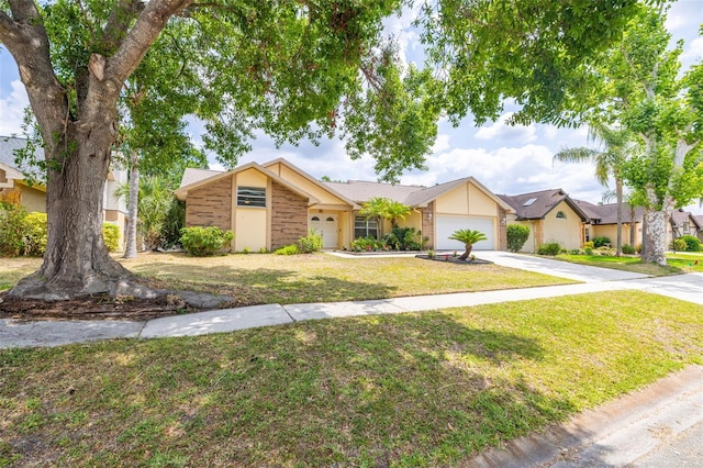 1426 Buckner Rd, Valrico, FL 33596 - view of front of home with a garage, concrete driveway, a front yard, and a residential view