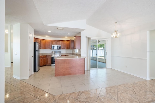 1426 Buckner Rd, Valrico, FL 33596 - kitchen featuring stainless steel appliances, a sink, open floor plan, brown cabinets, and lofted ceiling