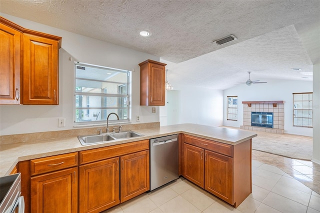 1426 Buckner Rd, Valrico, FL 33596 - kitchen featuring dishwasher, a sink, a peninsula, a ceiling fan, and brown cabinets