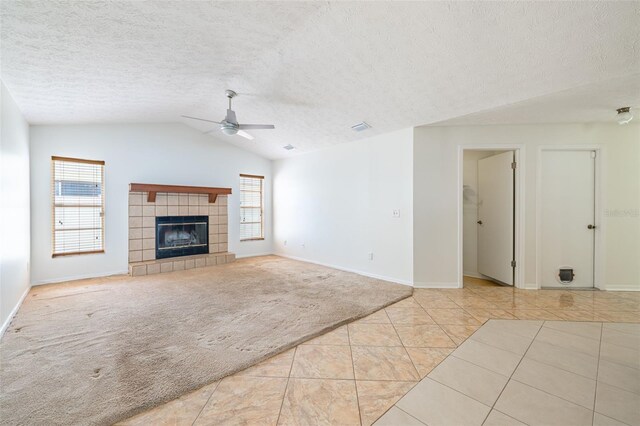 1426 Buckner Rd, Valrico, FL 33596 - unfurnished living room featuring a ceiling fan, a textured ceiling, tile patterned flooring, lofted ceiling, and baseboards