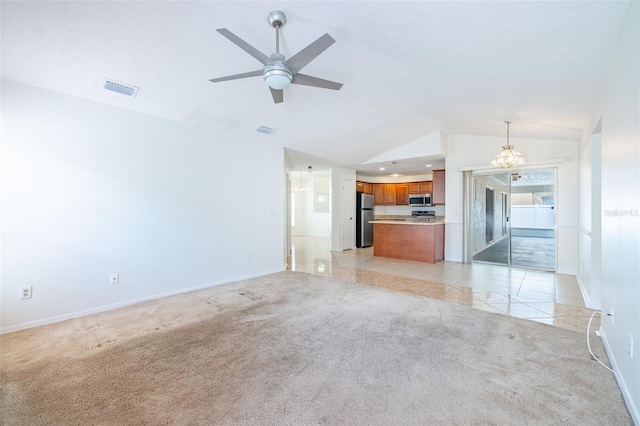 1426 Buckner Rd, Valrico, FL 33596 - unfurnished living room featuring light colored carpet, lofted ceiling, baseboards, and a ceiling fan
