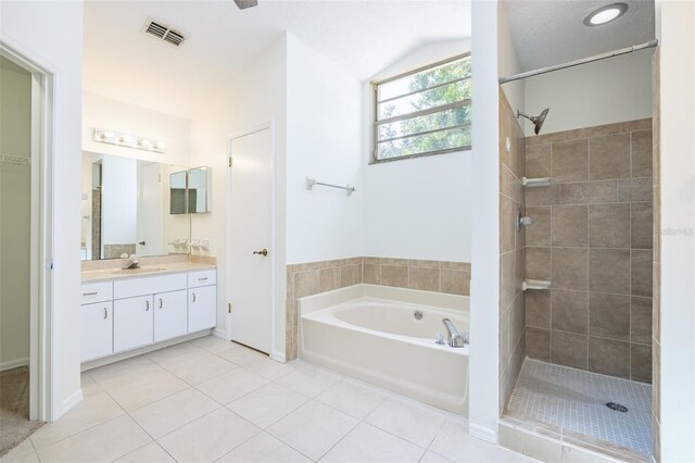 1426 Buckner Rd, Valrico, FL 33596 - full bathroom featuring tile patterned floors, tiled shower, vanity, lofted ceiling, and a bath