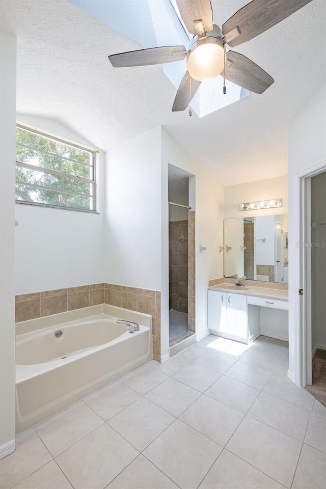 1426 Buckner Rd, Valrico, FL 33596 - bathroom featuring lofted ceiling, tile patterned floors, a bath, a textured ceiling, and a shower stall