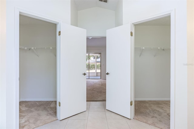 1426 Buckner Rd, Valrico, FL 33596 - unfurnished bedroom with carpet floors, a spacious closet, a closet, high vaulted ceiling, and tile patterned flooring