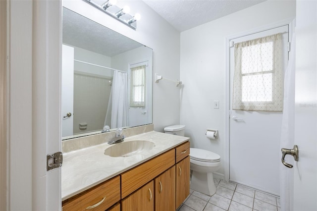 1426 Buckner Rd, Valrico, FL 33596 - full bathroom with healthy amount of natural light, toilet, tile patterned floors, and vanity