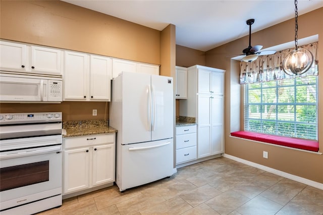 19025 Callaway Ct, Tampa, FL 33647 - kitchen with white appliances, ceiling fan, white cabinetry, light stone counters, and decorative light fixtures