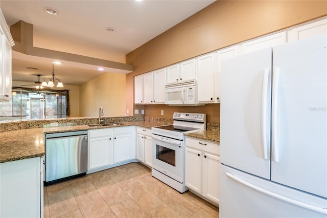 19025 Callaway Ct, Tampa, FL 33647 - kitchen featuring white appliances, a sink, white cabinetry, and recessed lighting