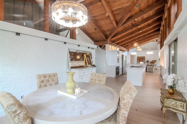 dining space featuring light wood-style flooring, wood ceiling, a chandelier, beam ceiling, and high vaulted ceiling