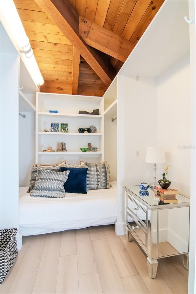 mudroom featuring wood ceiling, light wood-style flooring, and beam ceiling
