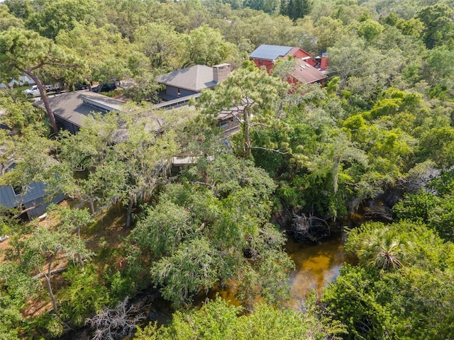 aerial view of property and surrounding area featuring a forest