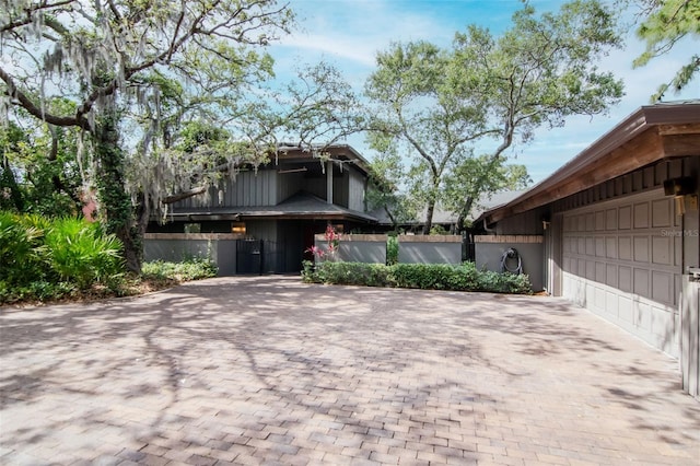 1296 Weybridge Ln, Dunedin, FL 34698 - view of property exterior with decorative driveway and an attached garage