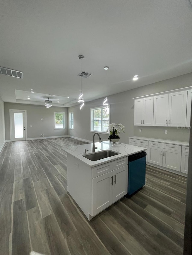 12308 Pittsfield Ave, Tampa, FL 33624 - kitchen with dishwasher, a sink, dark wood-style floors, a kitchen island with sink, and recessed lighting