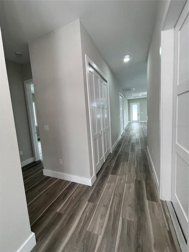 12308 Pittsfield Ave, Tampa, FL 33624 - hallway featuring dark wood-type flooring, baseboards, and recessed lighting