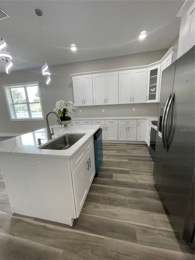 12308 Pittsfield Ave, Tampa, FL 33624 - kitchen featuring stainless steel refrigerator with ice dispenser, a sink, white cabinetry, light countertops, and recessed lighting