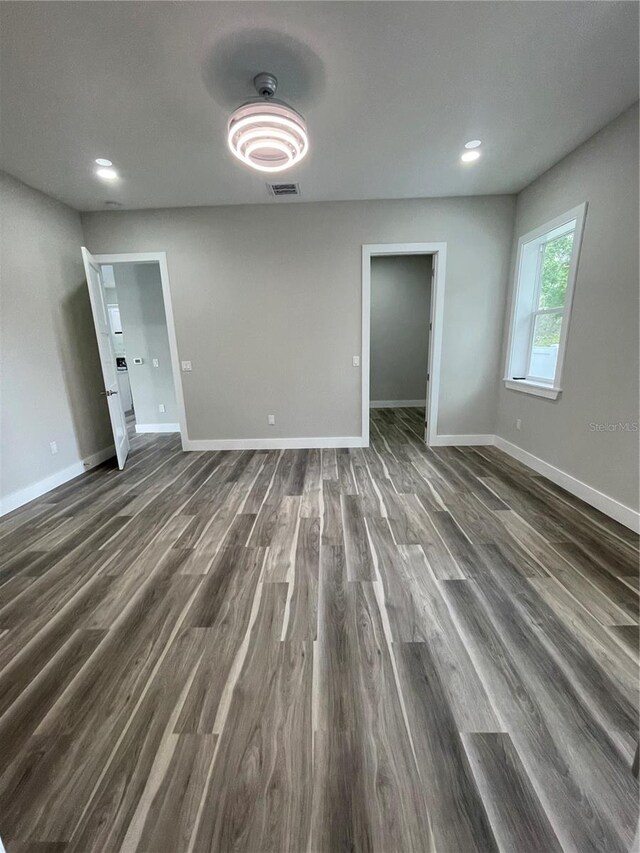 12308 Pittsfield Ave, Tampa, FL 33624 - empty room featuring dark wood-style flooring, baseboards, and recessed lighting