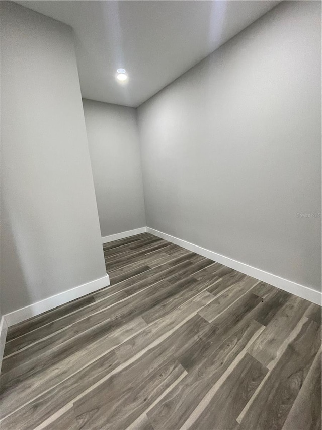 12308 Pittsfield Ave, Tampa, FL 33624 - empty room featuring baseboards, recessed lighting, and dark wood-style floors