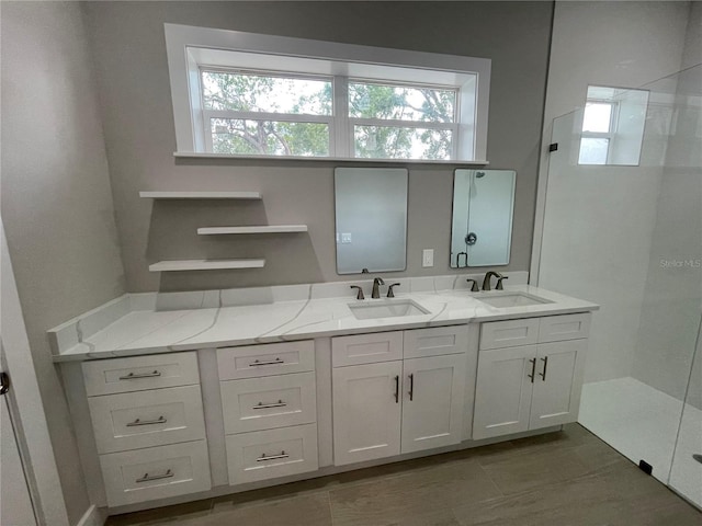 12308 Pittsfield Ave, Tampa, FL 33624 - bathroom with plenty of natural light, double vanity, and tiled shower