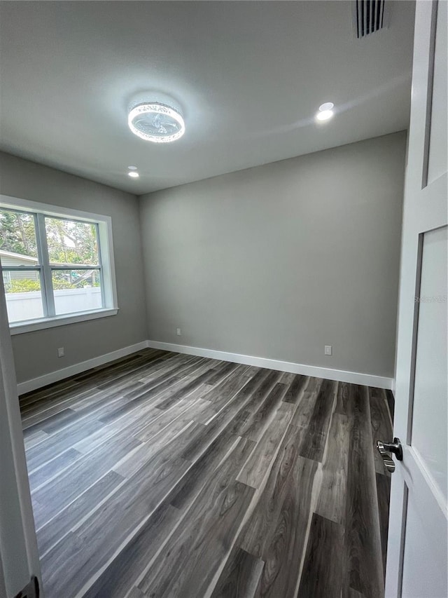 12308 Pittsfield Ave, Tampa, FL 33624 - spare room with dark wood-style floors and baseboards