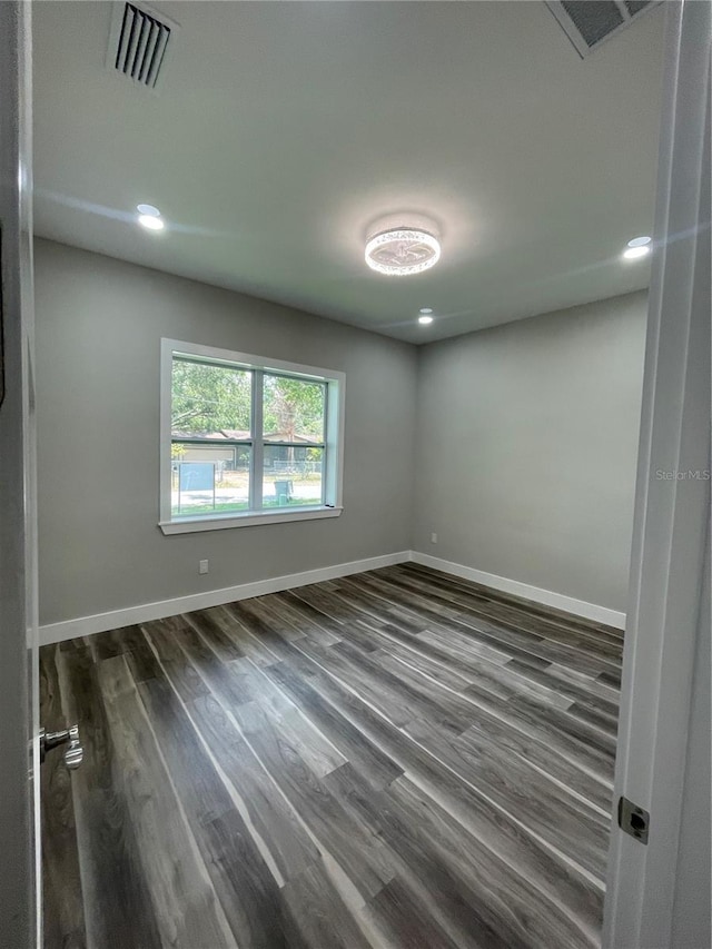 12308 Pittsfield Ave, Tampa, FL 33624 - empty room with dark wood-type flooring, baseboards, and recessed lighting