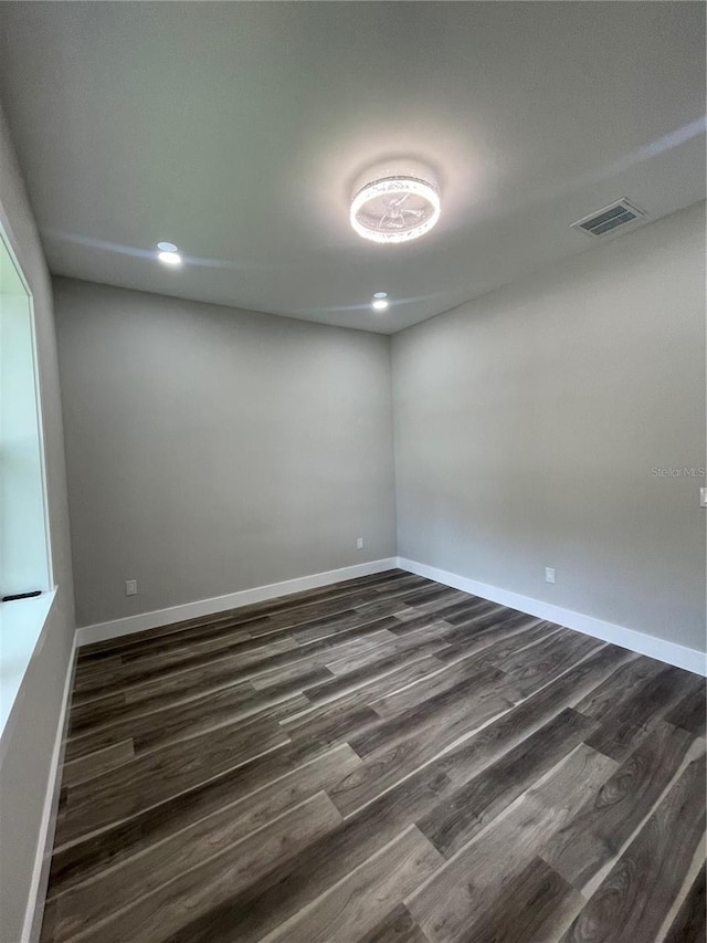 12308 Pittsfield Ave, Tampa, FL 33624 - spare room featuring dark wood-style floors, baseboards, and recessed lighting