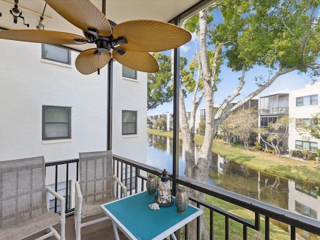 5980 Terrace Park Dr N Unit 214, Saint Petersburg, FL 33709 - balcony with a water view and a ceiling fan
