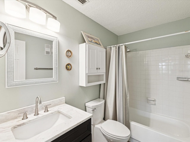 5980 Terrace Park Dr N Unit 214, Saint Petersburg, FL 33709 - full bath with toilet, a textured ceiling, shower / bathtub combination with curtain, and vanity