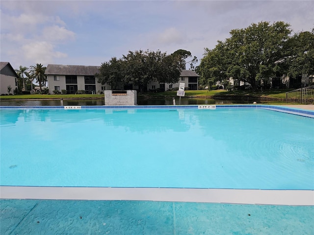 community pool with a lawn