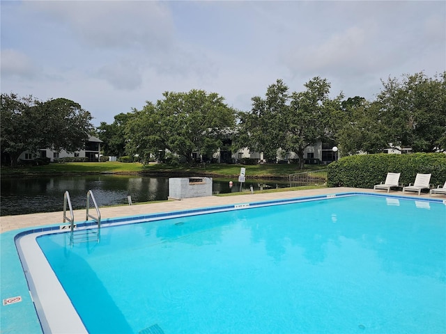 community pool featuring a water view