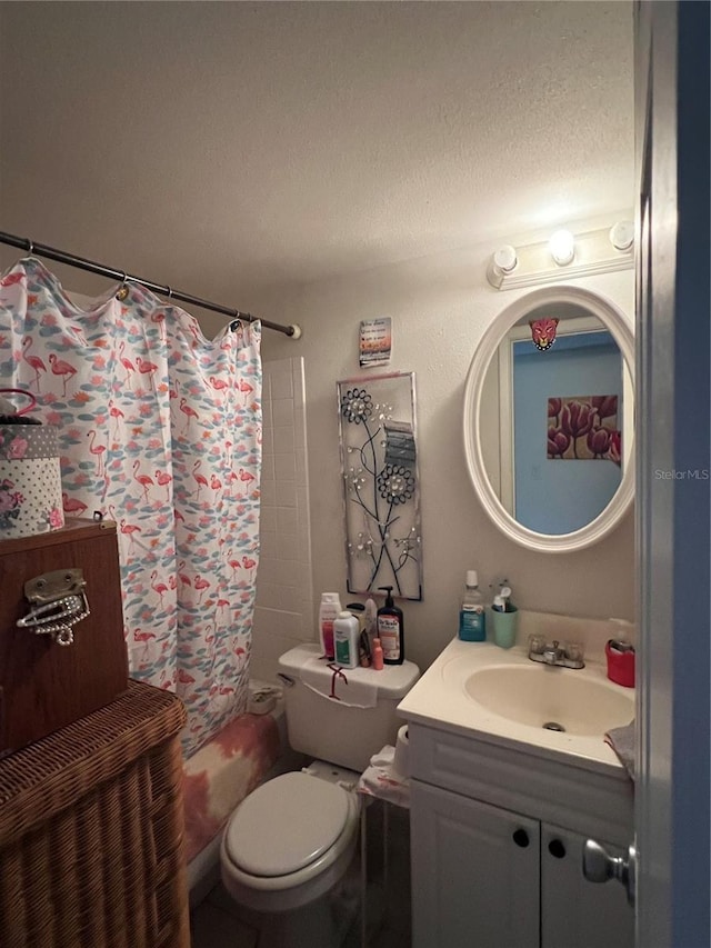 11201 122nd Ave Unit 129, Largo, FL 33778 - bathroom featuring vanity, toilet, shower / bath combo with shower curtain, and a textured ceiling