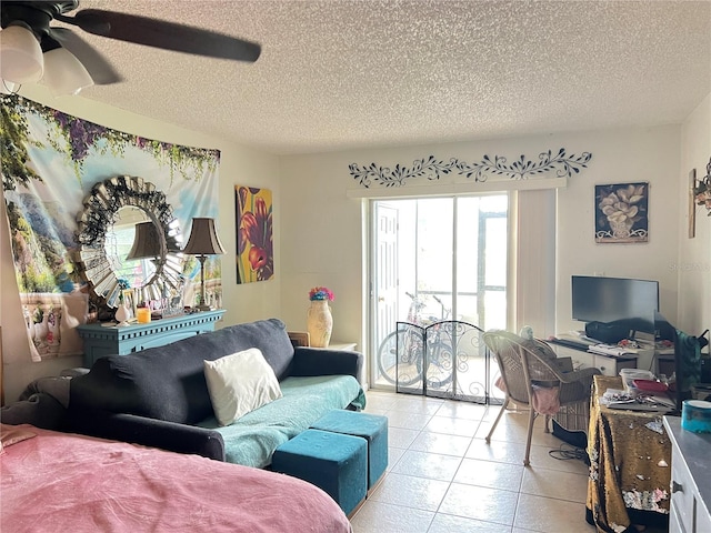11201 122nd Ave Unit 129, Largo, FL 33778 - tiled living area featuring a textured ceiling and ceiling fan