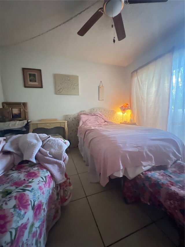 11201 122nd Ave Unit 129, Largo, FL 33778 - bedroom featuring tile patterned floors and a ceiling fan