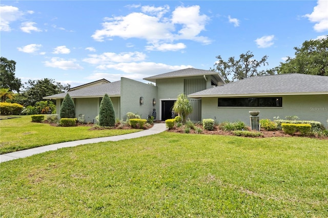 4009 Carrollwood Village Dr, Tampa, FL 33618 - mid-century home with a front lawn and stucco siding