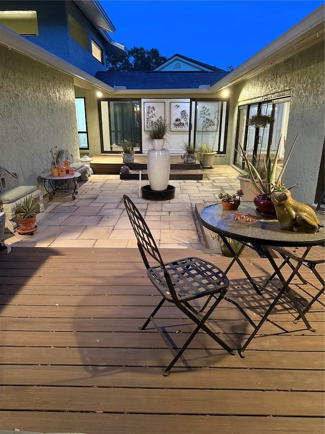 4009 Carrollwood Village Dr, Tampa, FL 33618 - deck at twilight featuring a patio area